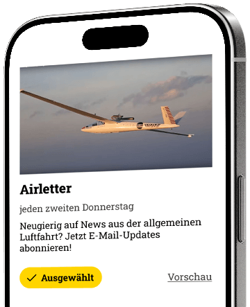 Ein Bild von einem Segelflugzeug in der Luft, das Luftfahrt und Abenteuer vermittelt.